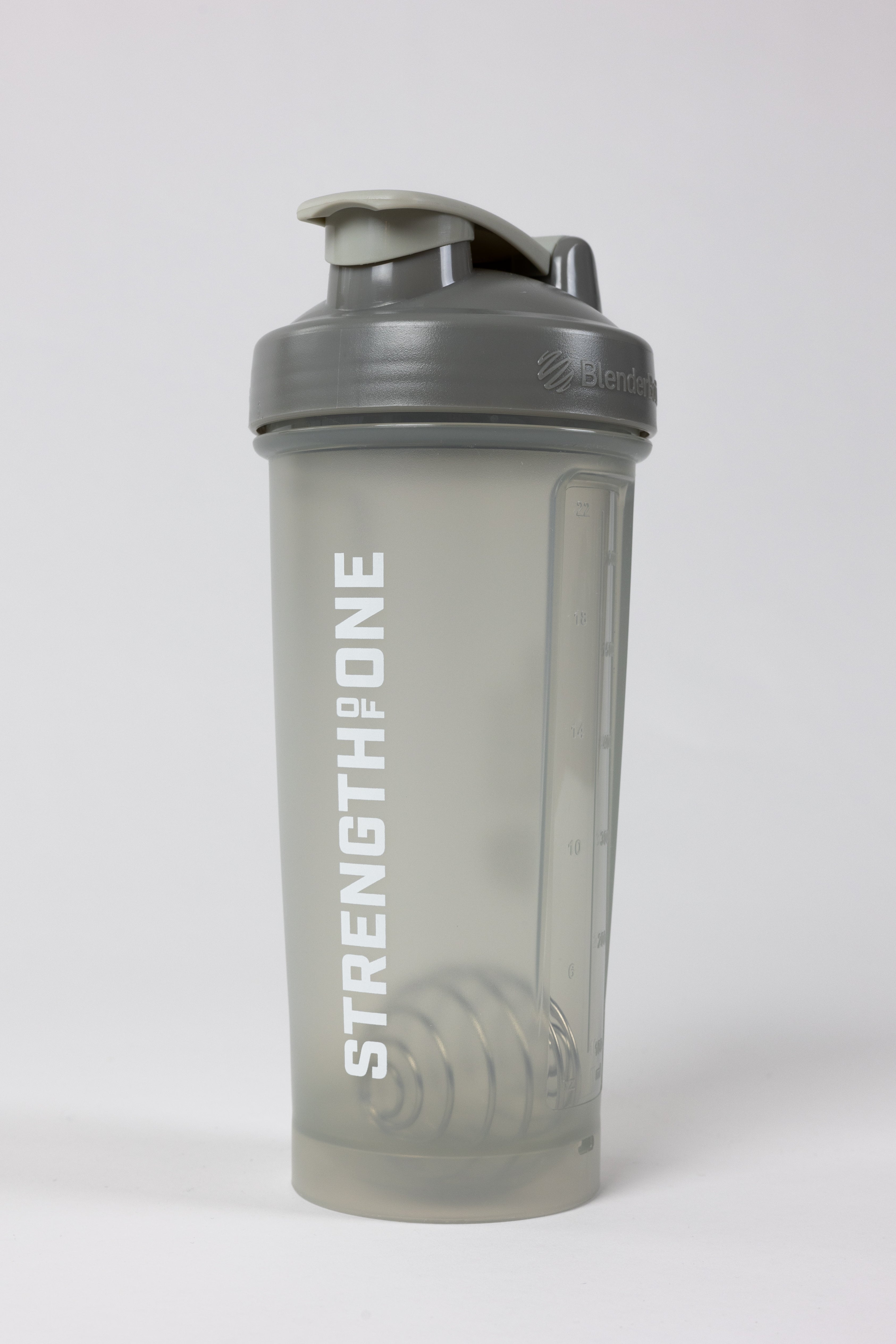 A shaker bottle with the word "Strength Of One" on it, perfect for mixing protein shakes and staying fit.