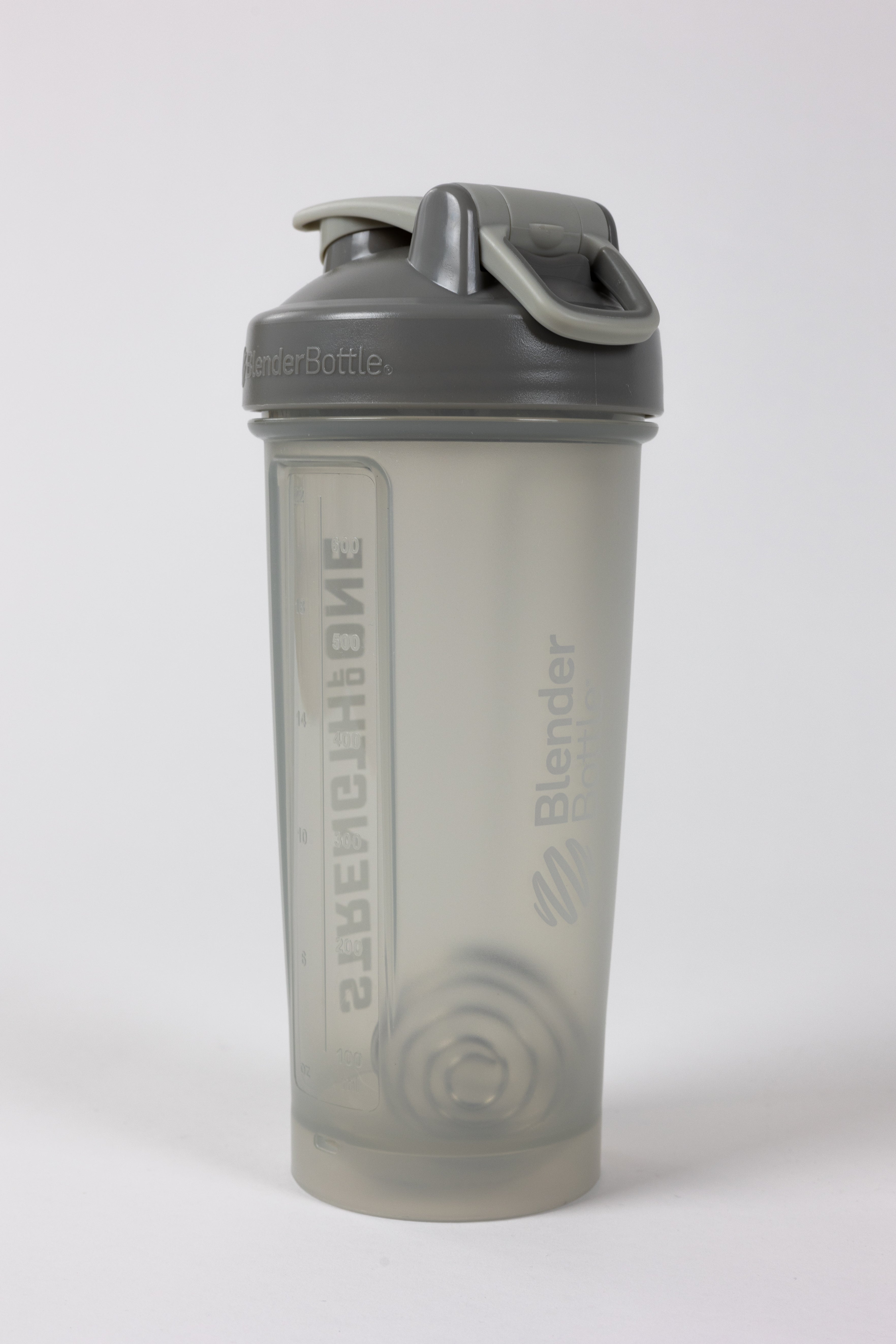 A shaker bottle with the word "Strength Of One" on it, perfect for mixing protein shakes and staying fit.