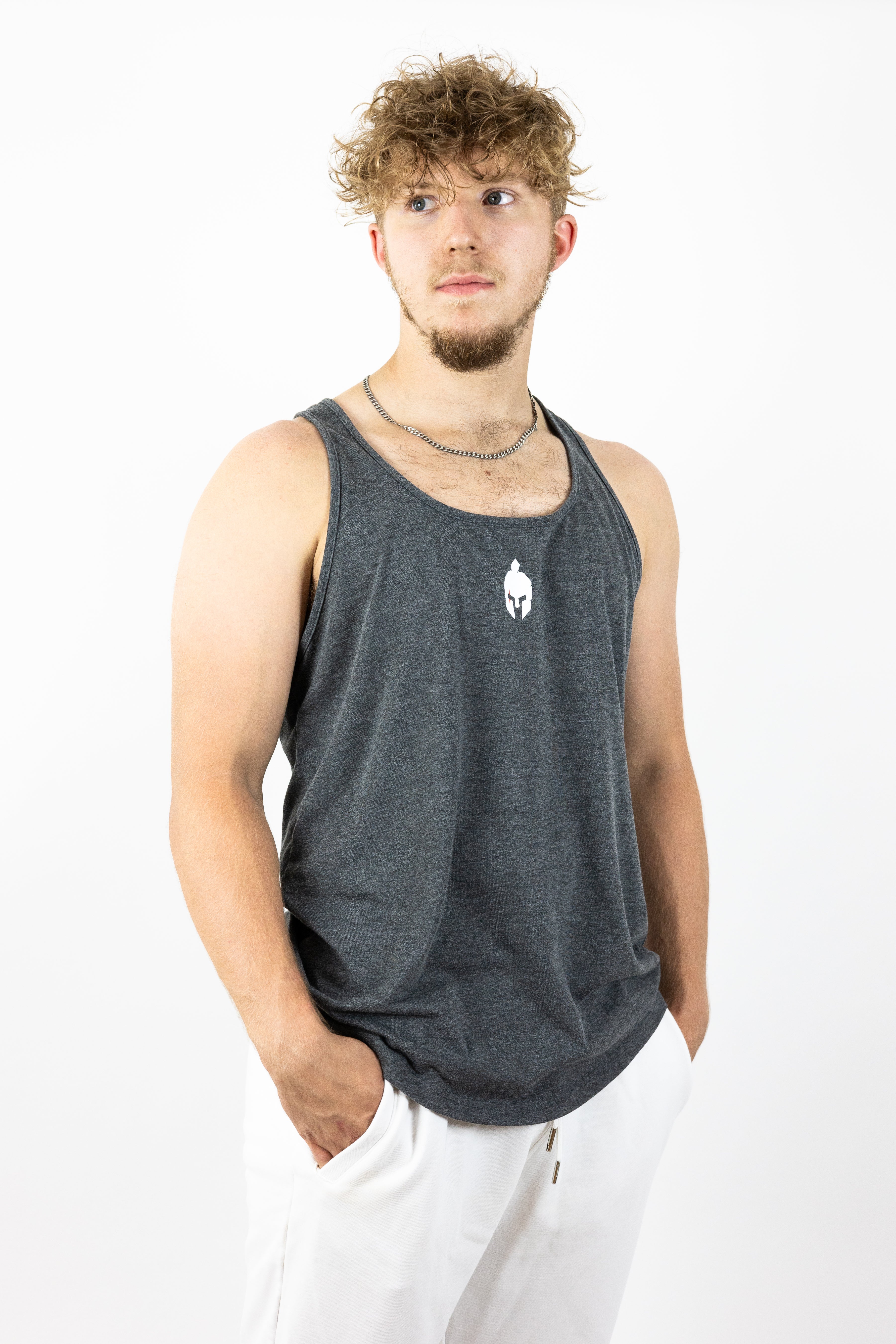 Man wearing gray stringer looking left