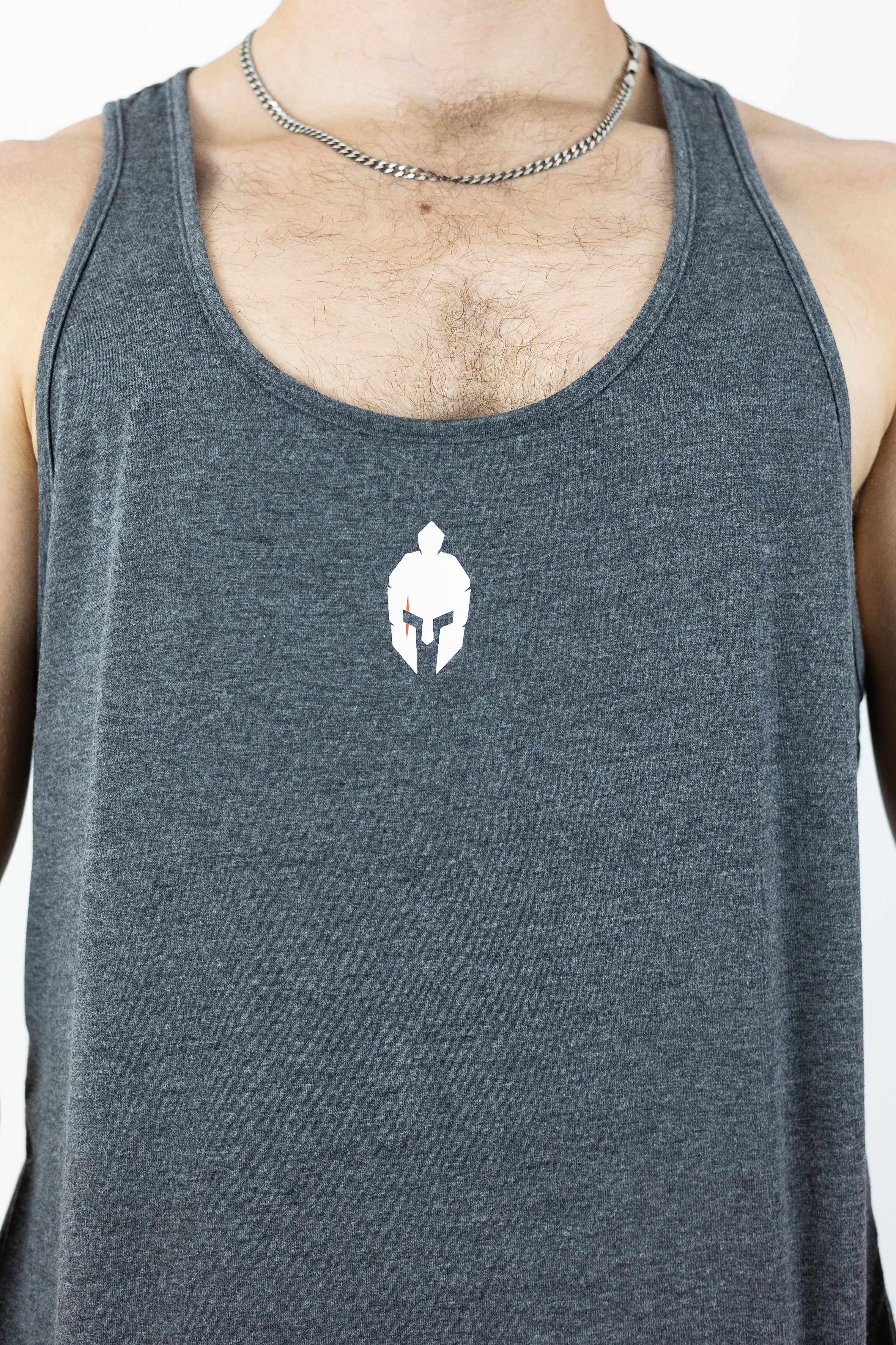 Gray stringer with roman helmet with orange scar on left eye logo on center of stringer