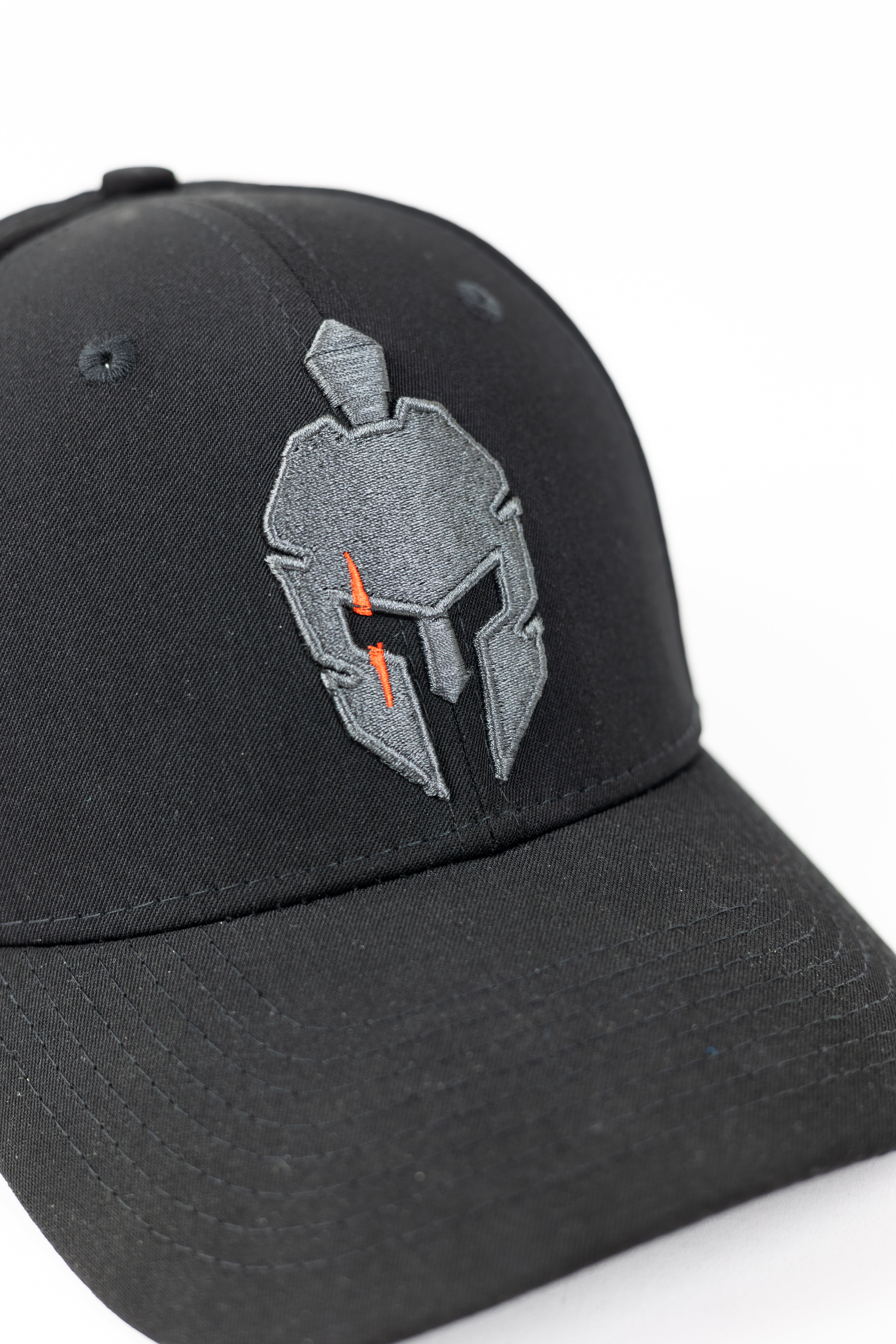 Black Strength of One baseball cap with a gray and orange spartan helmet emblem.