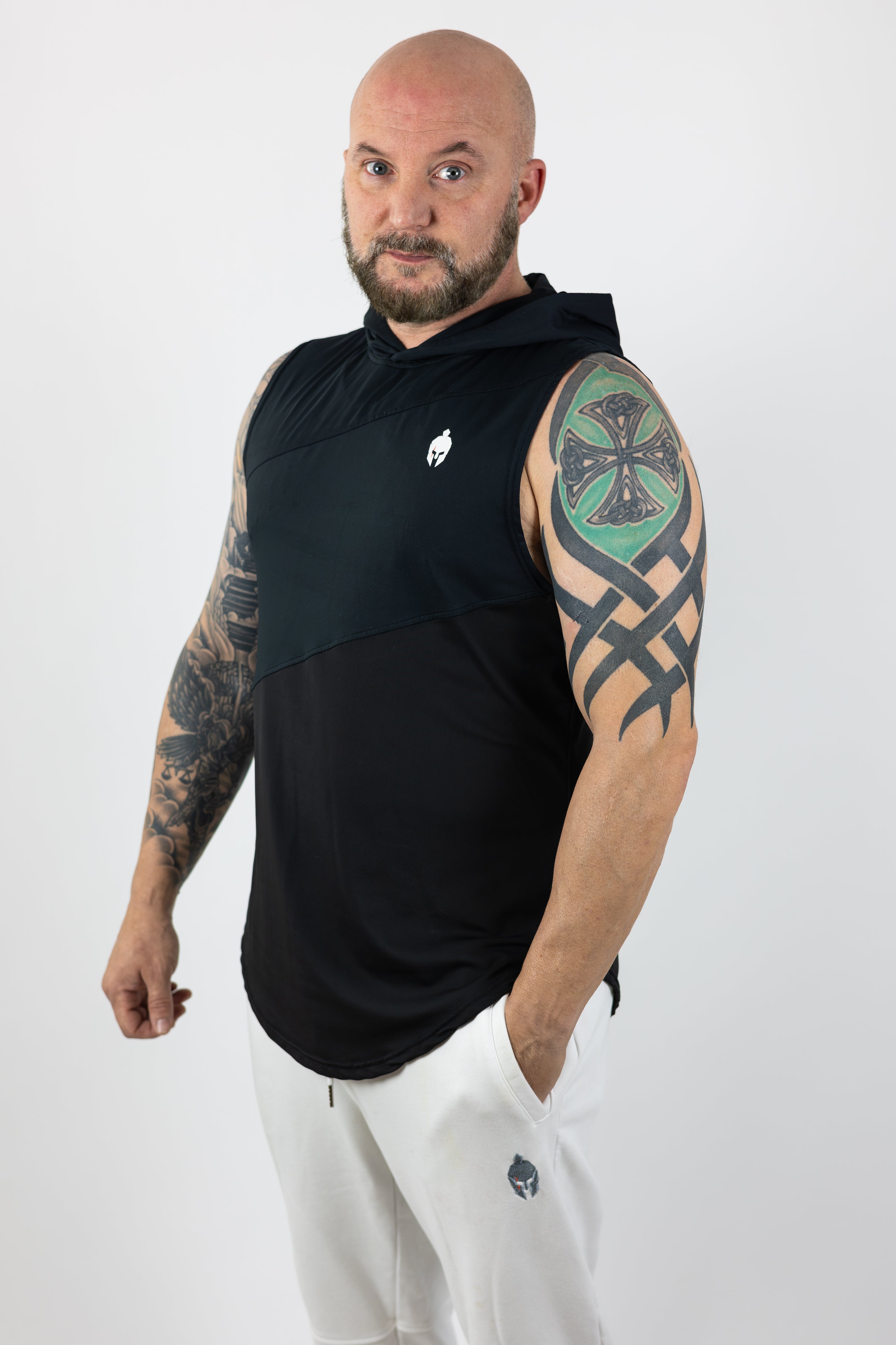 man wearing black Strength of One sleeveless top with helmet logo on right chest