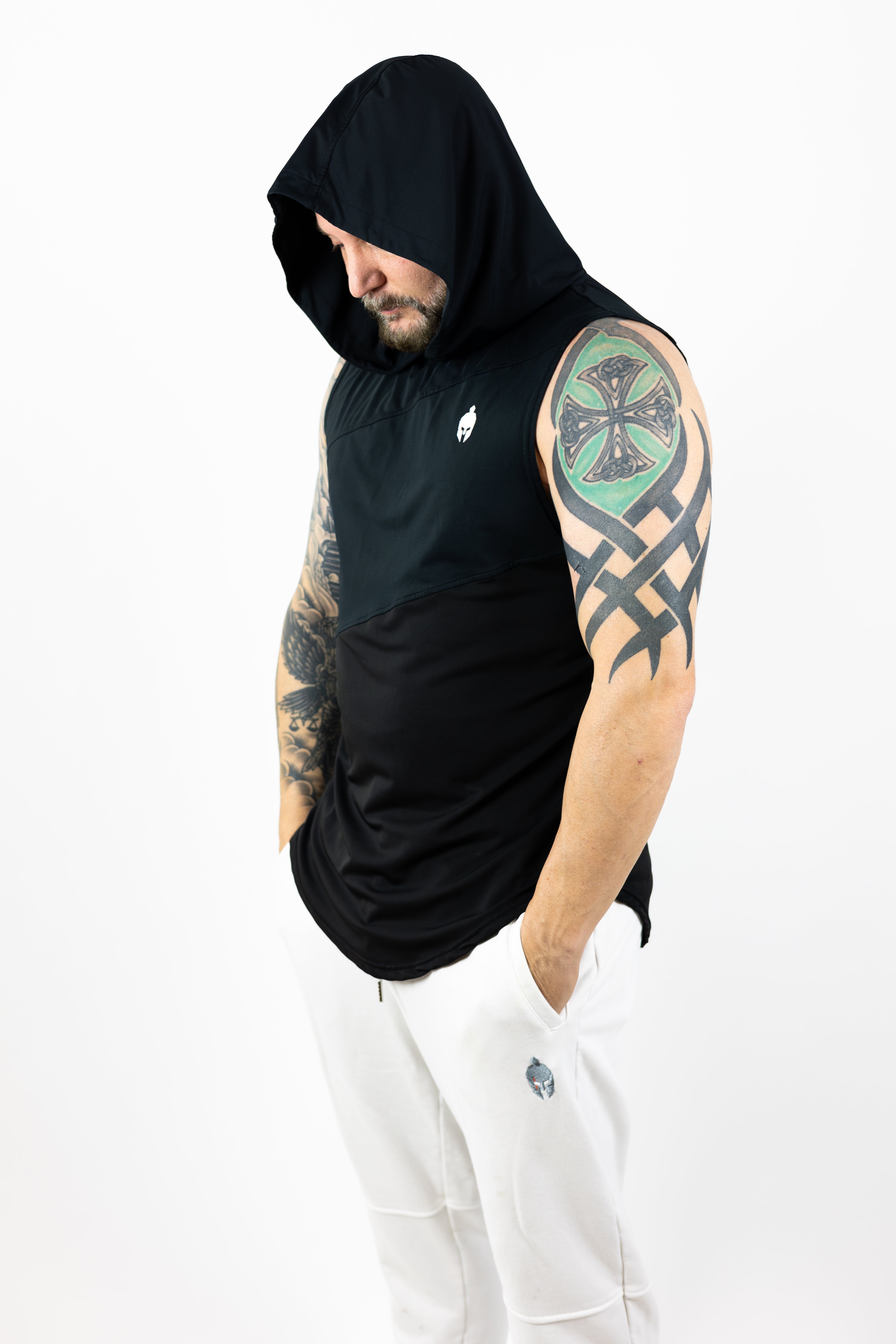 man wearing black Strength of One sleeveless top with helmet logo on right chest and hood is up