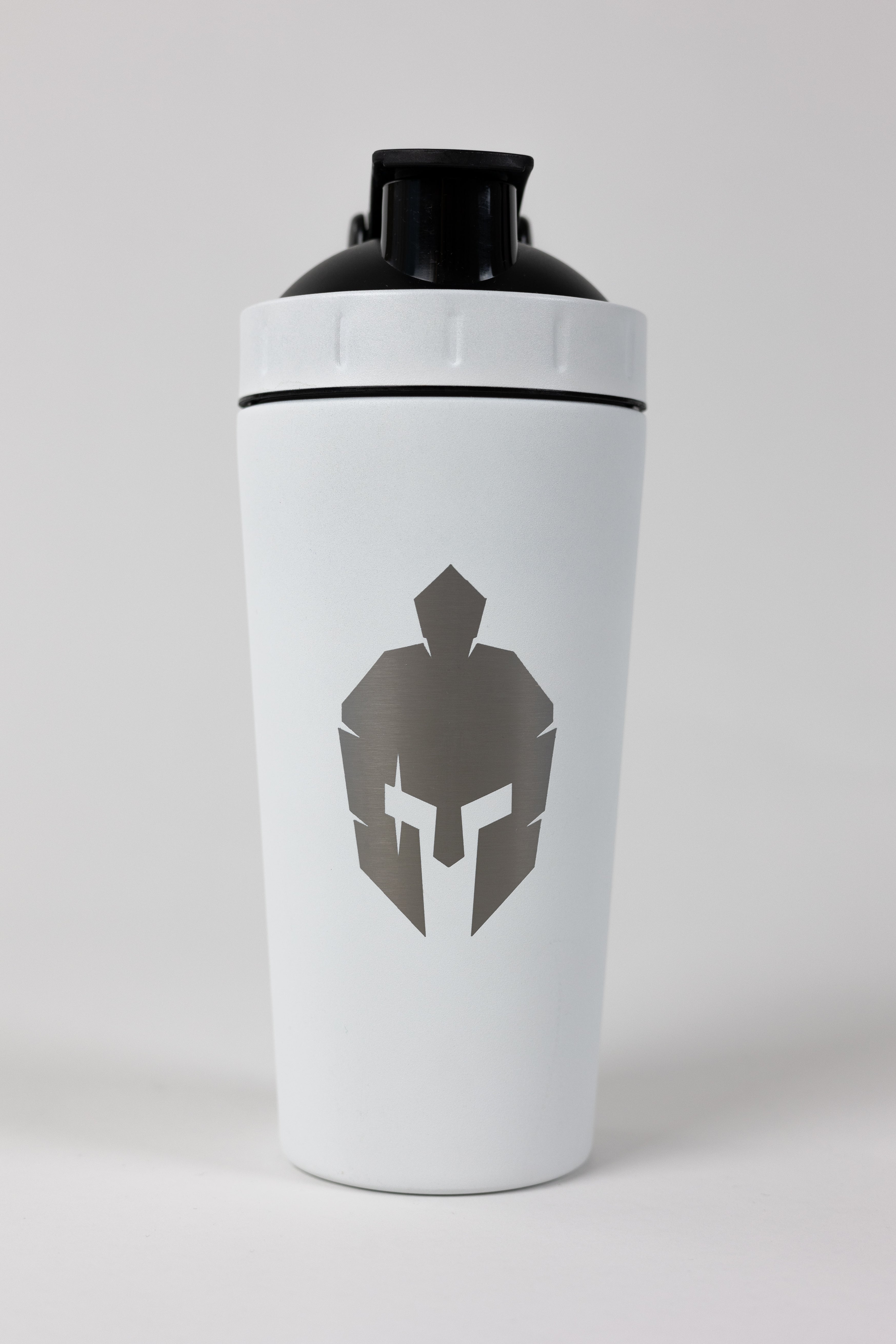 White metal protein shaker bottle with roman helmet logo on front