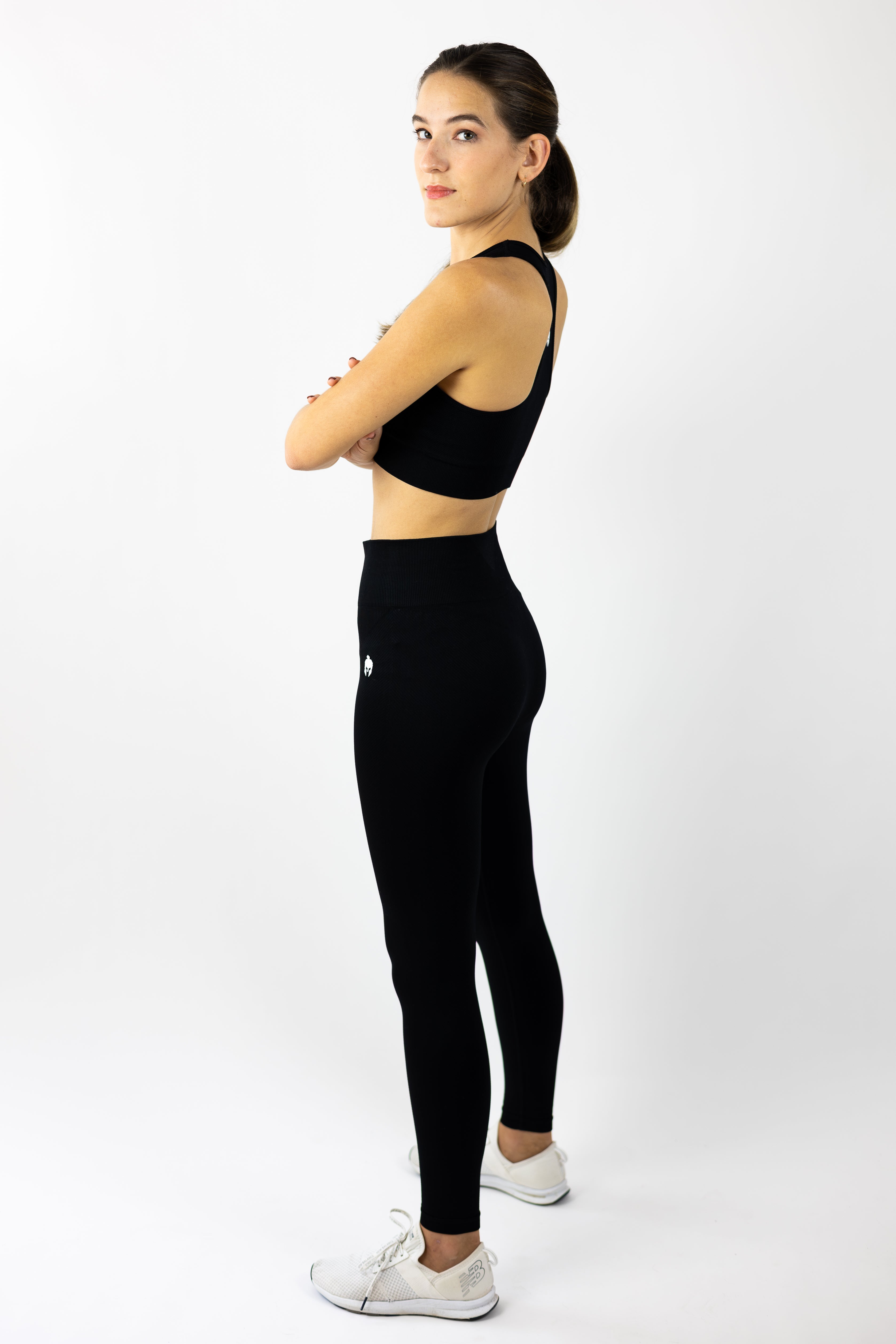 woman modeling Strength of One black yoga pants and sports bra seamless set