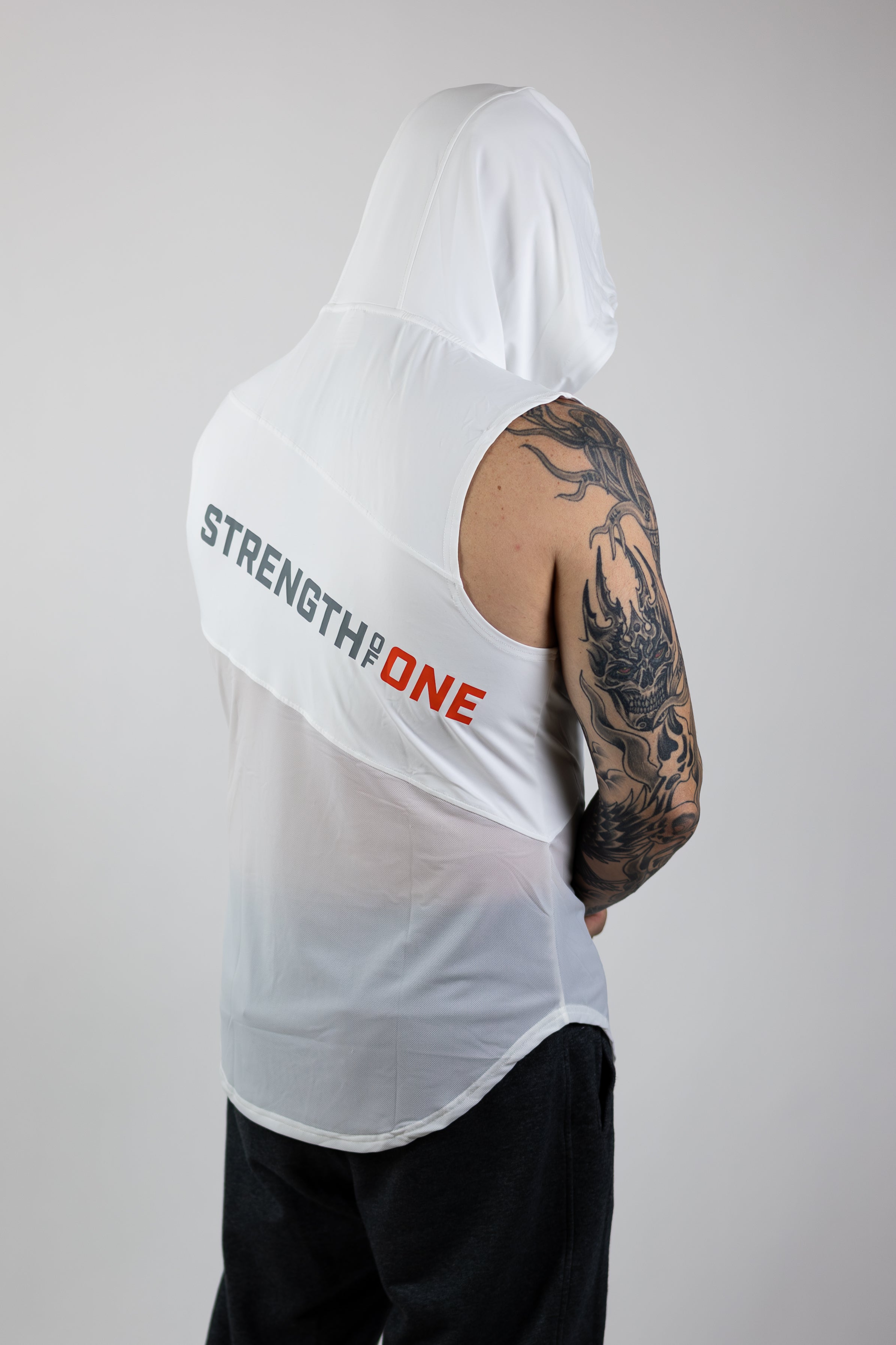 rear view of man wearing white Strength of One hooded tank top with logo angled down back